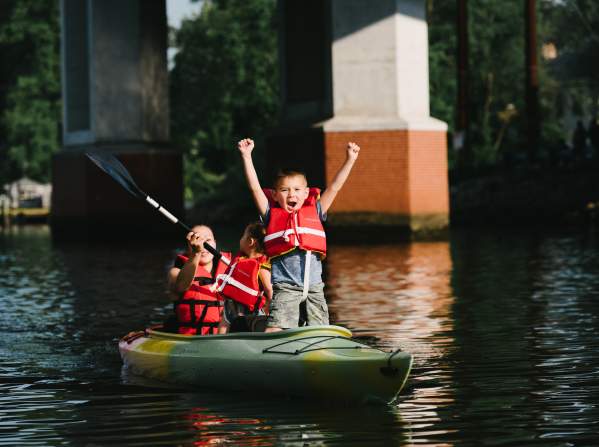 A woman and two children kayaking
