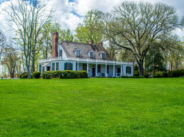 A white house with trees in the background