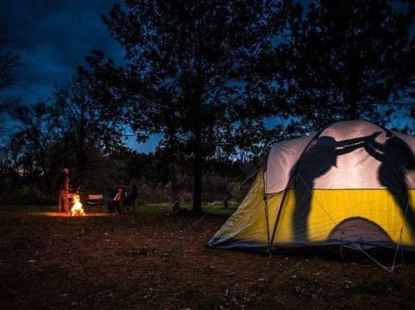 People inside a camping tent