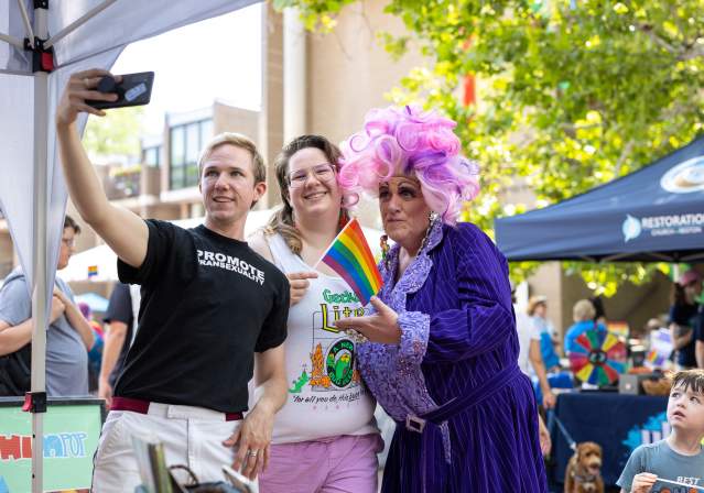 Group taking a selfie during the pride festival at Lake Anne.