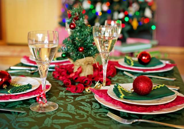 holiday table setting with champagne flutes and Christmas decorations