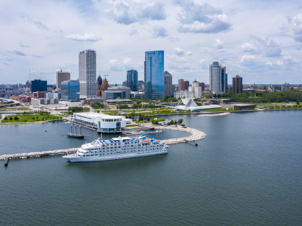 drone shot of the Pearl of the Mist Cruiseline in front of the Milwaukee skyline