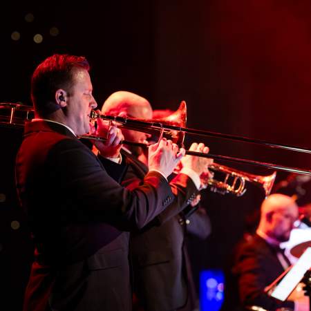 A live band playing brass instruments