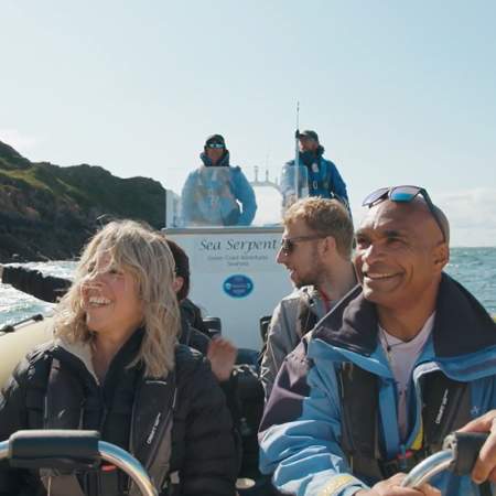 A boat full of people sightseeing
