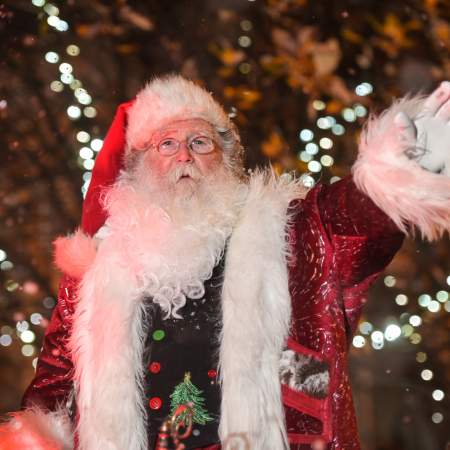 Father Christmas waving from his sleigh in the Swansea Christmas Parade