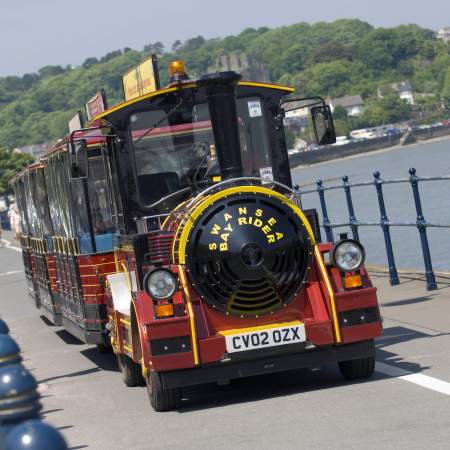 Swansea Bay Rider Land Train running along Swansea Prom