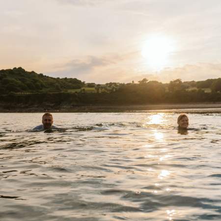 Two people swimming in the sea