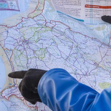 Hikers pointing at a map