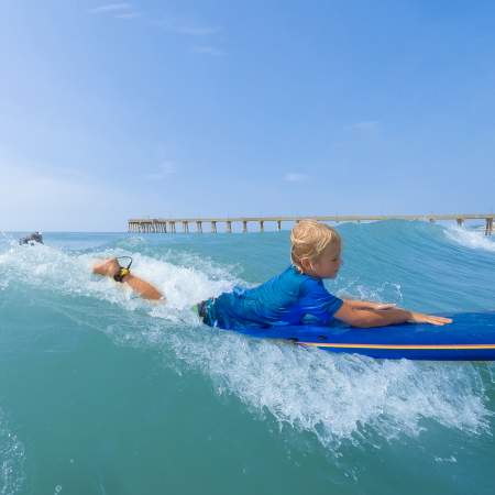 Child on a Boogie Board in the ocean