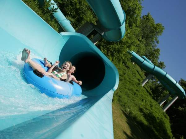 Young children on a water slide at Lake Raystown Resort's Wild River Waterpark