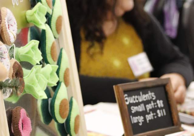 A booth displaying handmade art at the Bloomington Handmade Market