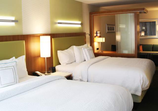 Two-queen hotel room in Bloomington