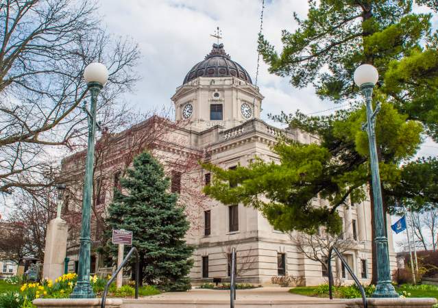 The Monroe County Courthouse amongst budding foliage in early spring