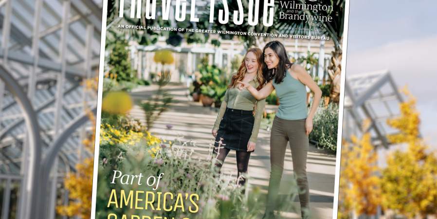 2025 Visitor Guide Cover on Blurred Background