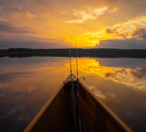 Canoe Fishing at Sunset