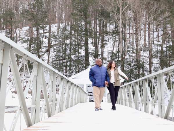 couple walking on a bridge in Winter