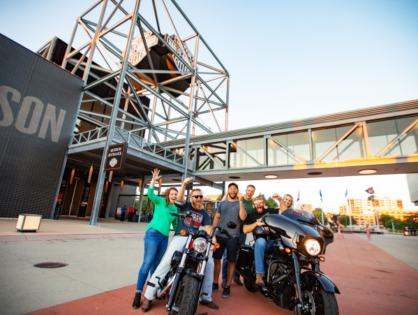 Friends on/around motorcycles at Harley Davidson