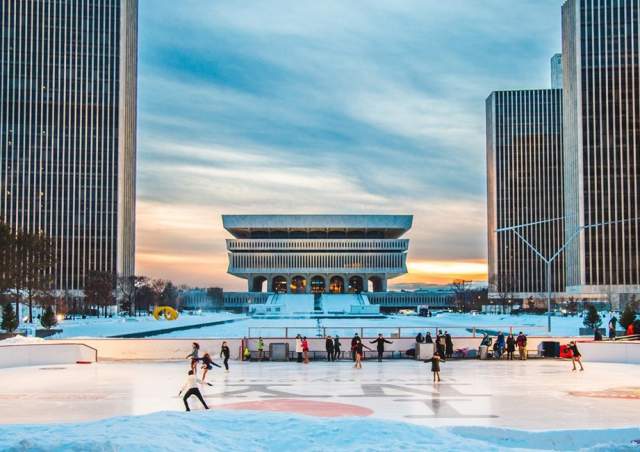 People ice skating at the Empire State Plaza ice rink
