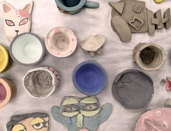 pottery collection at the Amarillo Museum of Art featuring felines and abstract faces