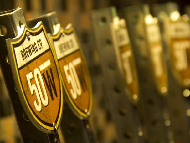 Beer taps at Fifty West Production Works (photo: Fifty West Brewing Co.)