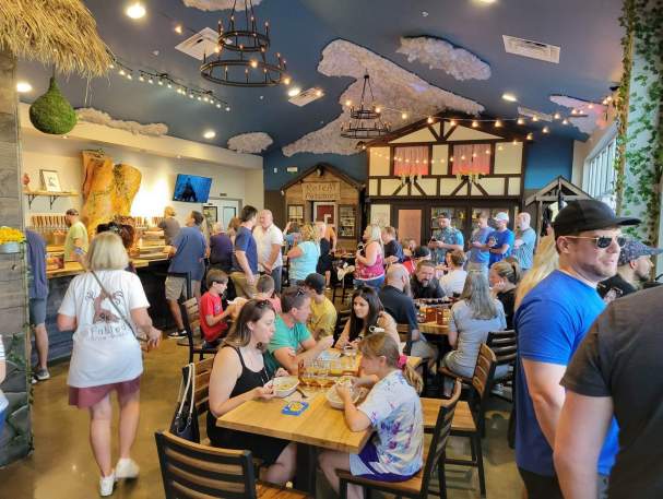 A crowd of people enjoy the taproom at Fabled Brew Works