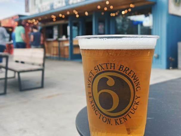 A plastic cup full of beer at the West Sixth Box park at Newport on the Levee