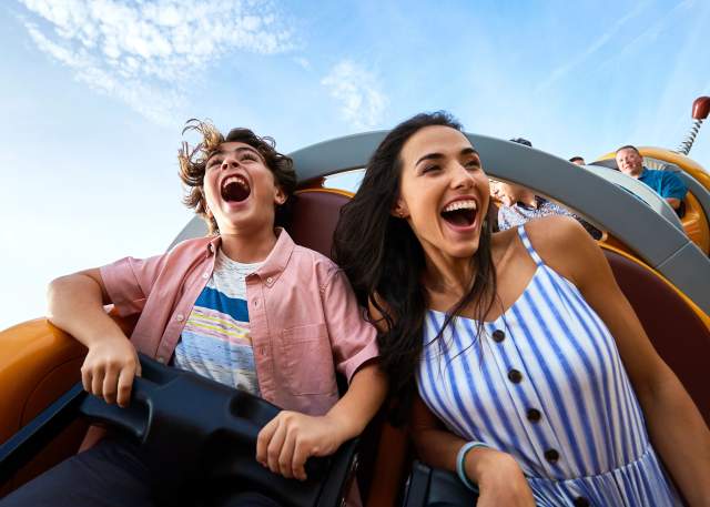 A mother and son on the Slinky Dog Dash rollercoaster in Toy Story Land at the Magic Kingdom in the Walt Disney World Resort, Do not use - For use only on new Website