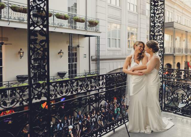 LGBT brides on balcony
