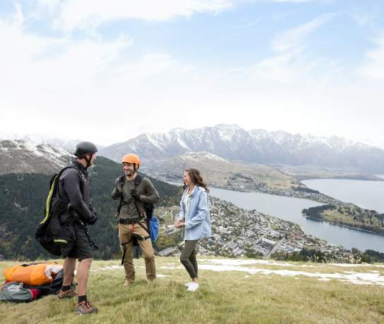 Couple paragliding from Bobs Peak