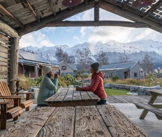 Guests enjoying a hot drink at Headwaters Eco Lodge, Glenorchy