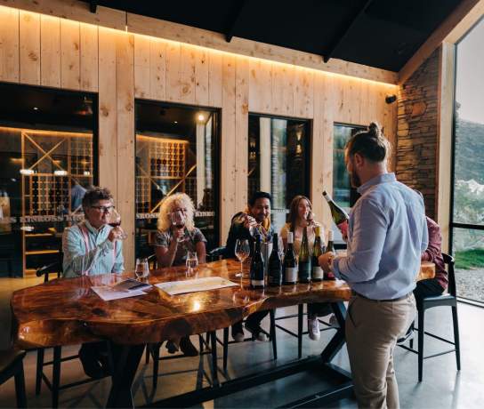 A group of people attending a wine tasting at Kinross in Gibbston near Queesntown