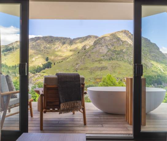 A landscape image of Coronet Ridge Resort Shotover View Room on a sunny day