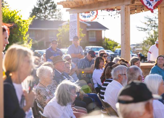 A group of Cedar City residents gather at a city event in Historic Downtown.