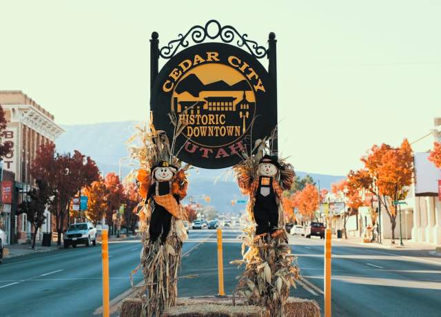 Historic downtown Cedar City with fall decor and bright fall leaves