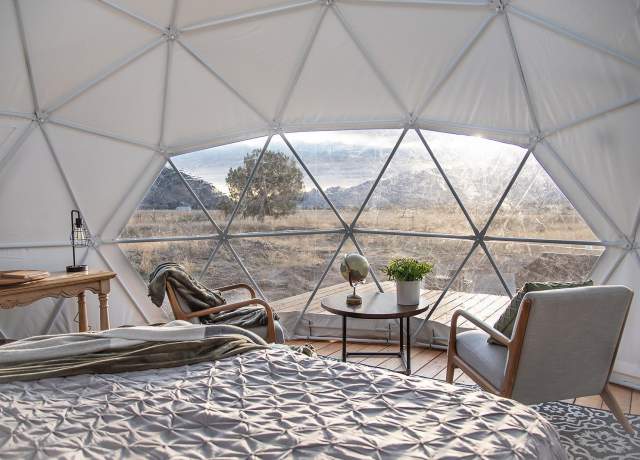 Early morning light through the window of a geodesic dome at Little Village Retreat in Kanarraville, Utah.