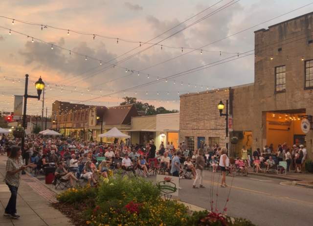 The streets of downtown Columbiana are filled with visitors enjoying live music under a brilliant sunset at the Sunset Music and Market.