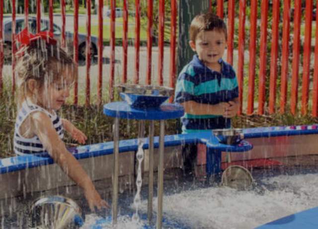 Kids playing with fountain