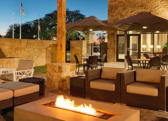 Luxury outdoor hotel patio with fireplace