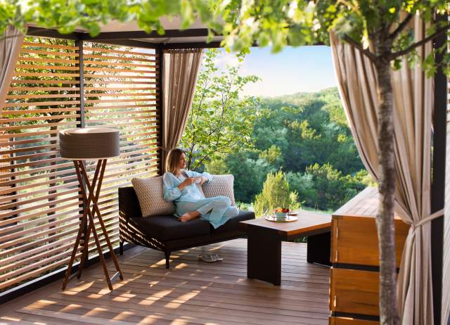 Woman relaxing at La Cantera Resort & Spa with drink