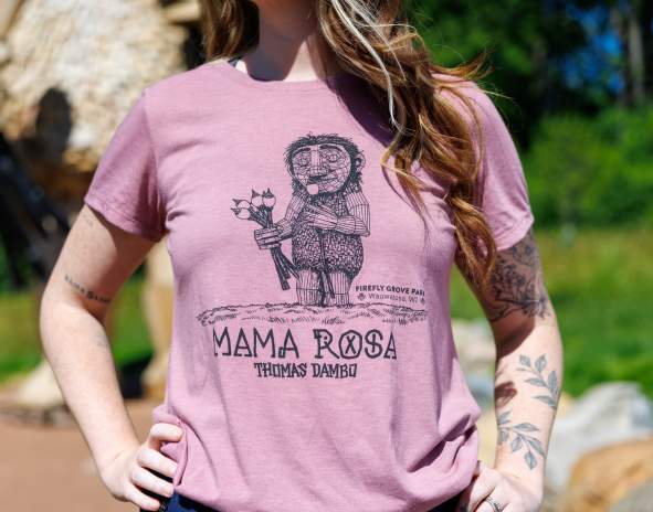 Woman wearing a pink t-shirt with Mama Rosa graphic on it