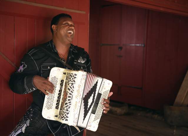 Chubby Carrier playing accordion