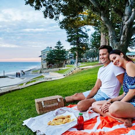 Couple sitting at Cottesloe Beach