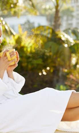 Woman relaxing with hot drink at a Dana Point spa resort