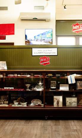 Interior of the Red River Railroad museum in the Katy Depot. Shelving unit of local history donated from family members whose parents and grandparents worked for the MKT.