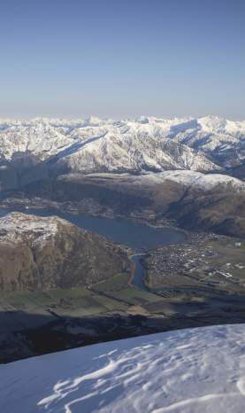 View from The Remarkables Lookout of dramatic snow-covered mountains and lake