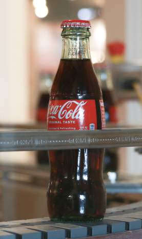 Coke bottle on production line in museum