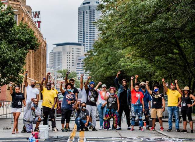 Black artists paint a Black Lives Matter mural on Indiana Avenue