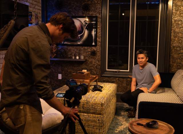 Filmmaker with camera shooting movie with Austin Asian American Film Festival