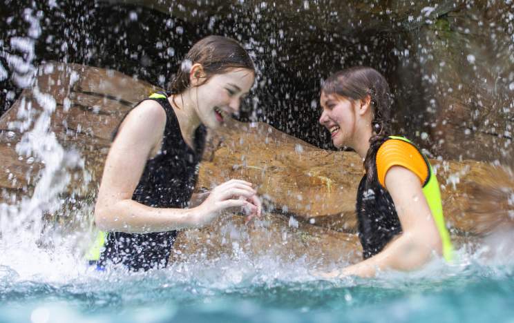 Girls playing in Discovery Cove Waterfall, Updated expiration date by Melissa, please see email attachment