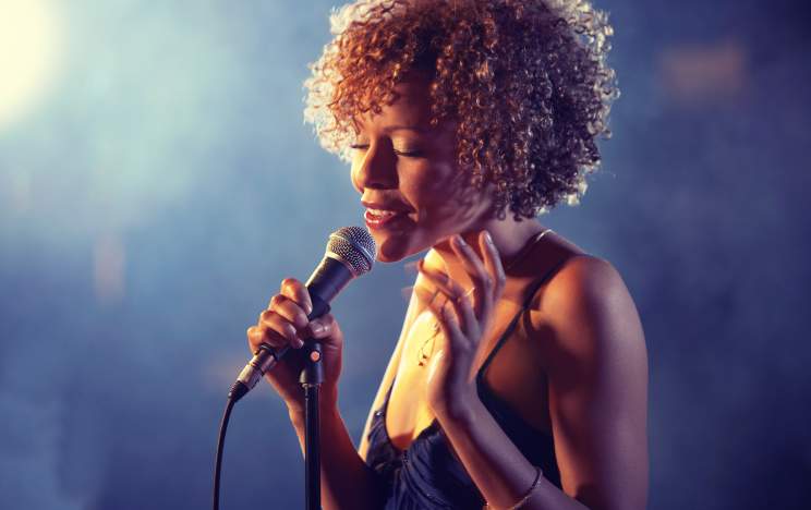 Black female Singer Performing on stage